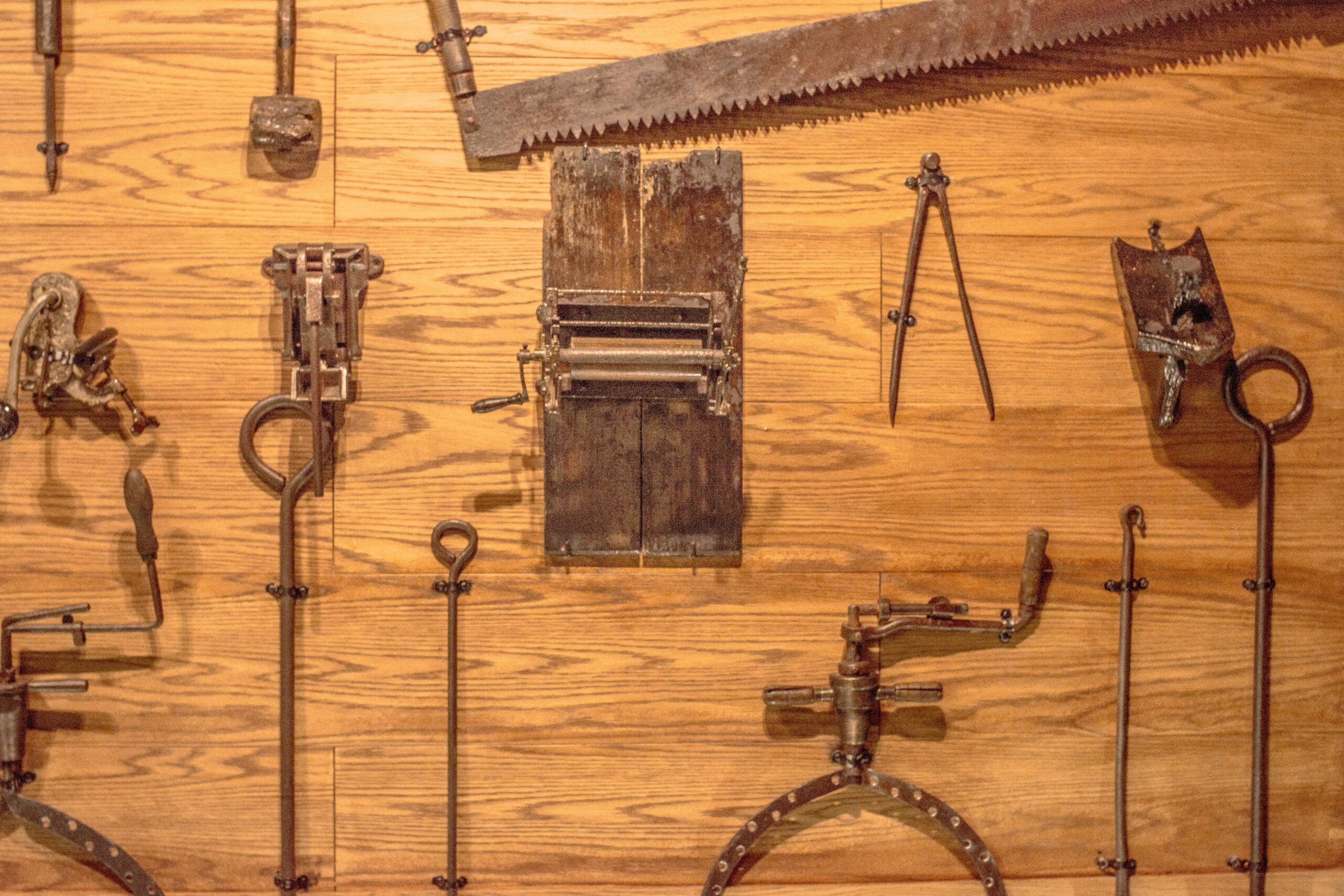 A wall-mounted pegboard displaying neatly arranged tools