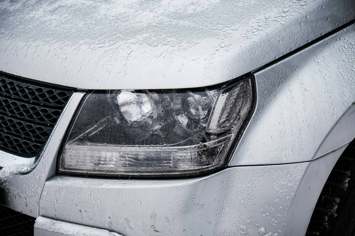 Before and after images of a car repaired from hail damage, showing smooth metal versus dented surface.